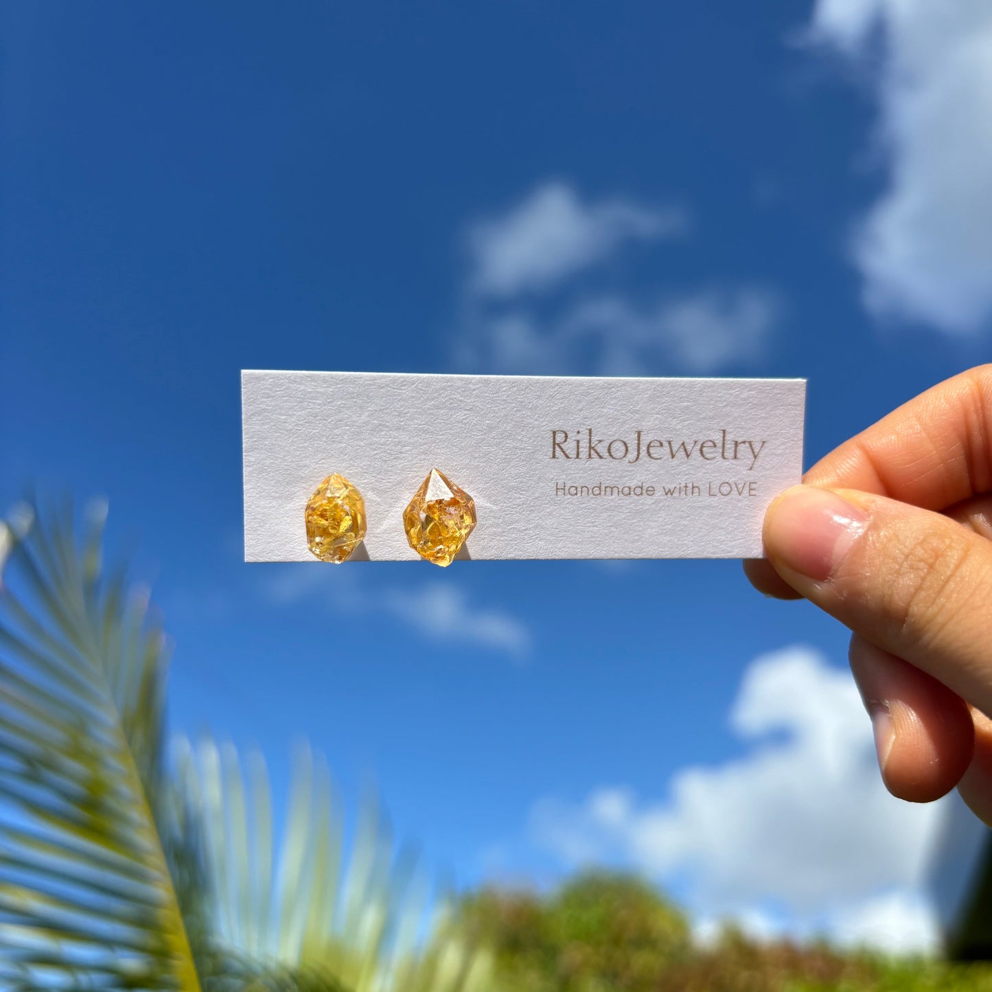 Real flowers in gem shaped stud earrings