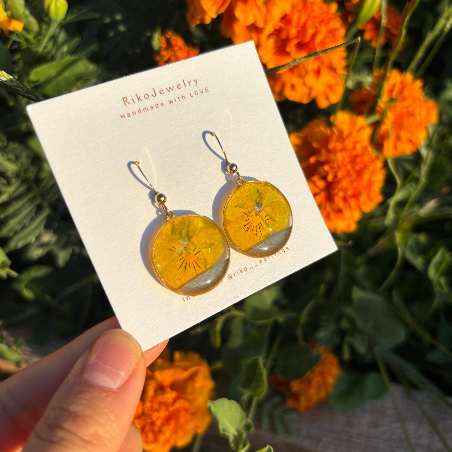 Yellow pansy round shaped earrings