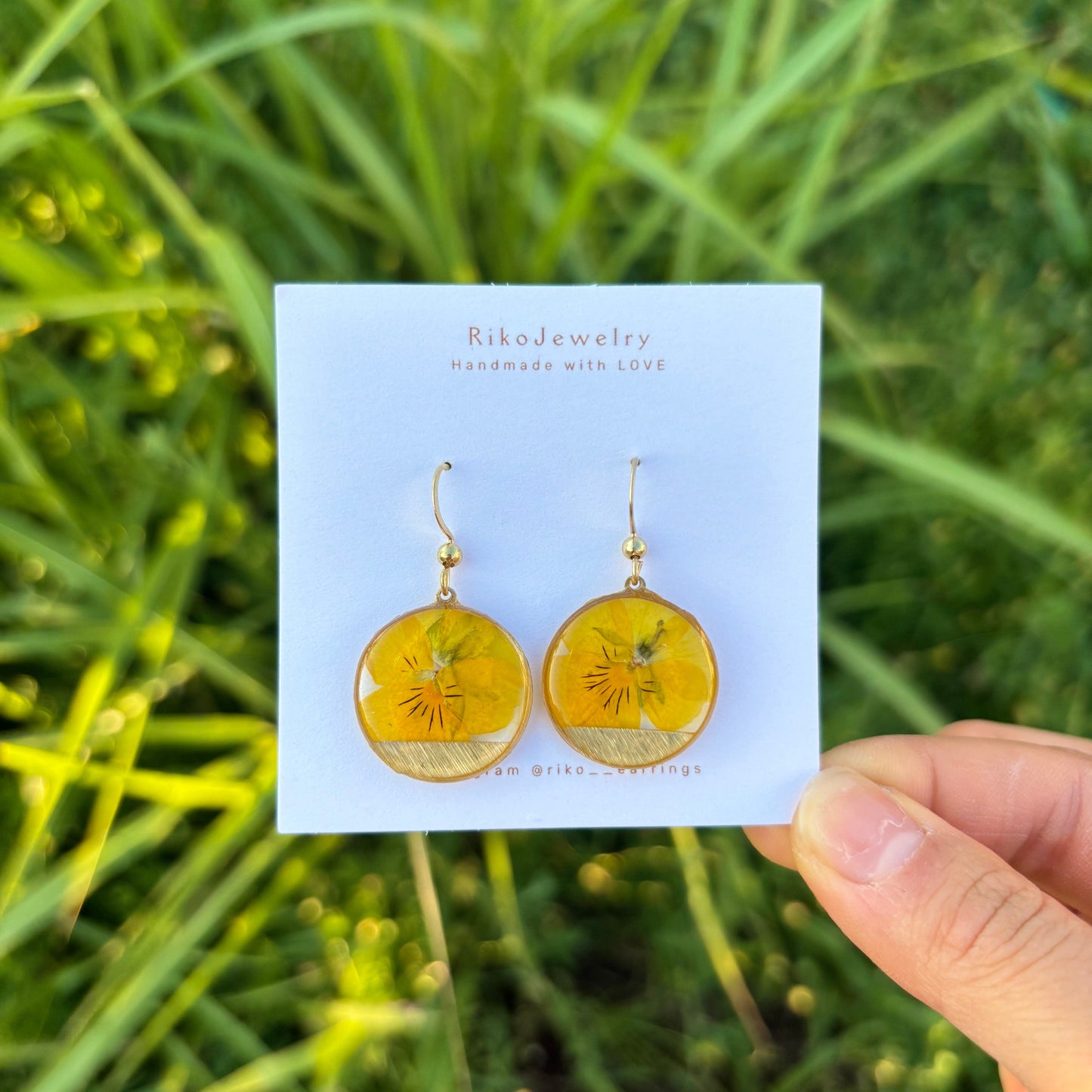 Yellow pansy round shaped earrings