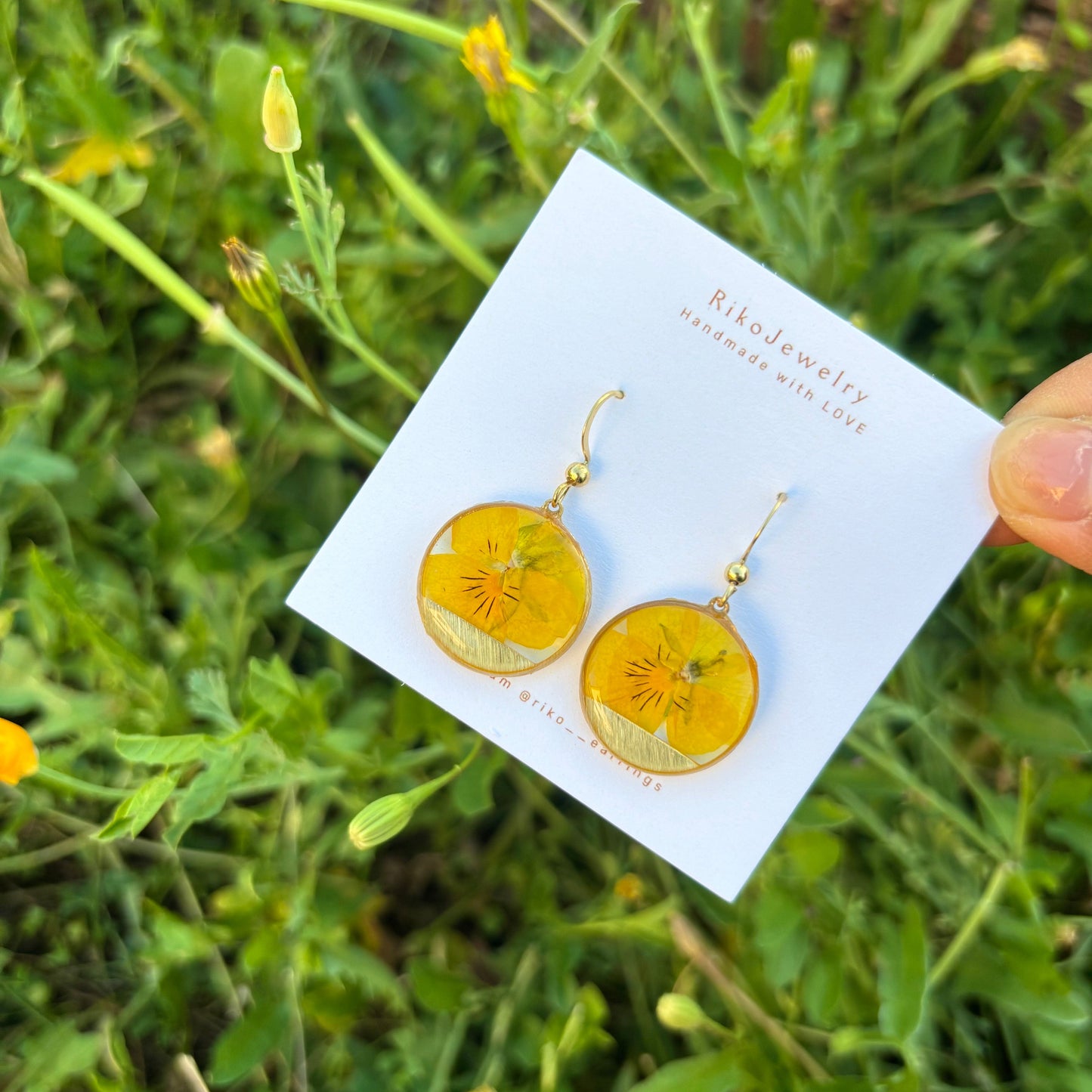 Yellow pansy round shaped earrings