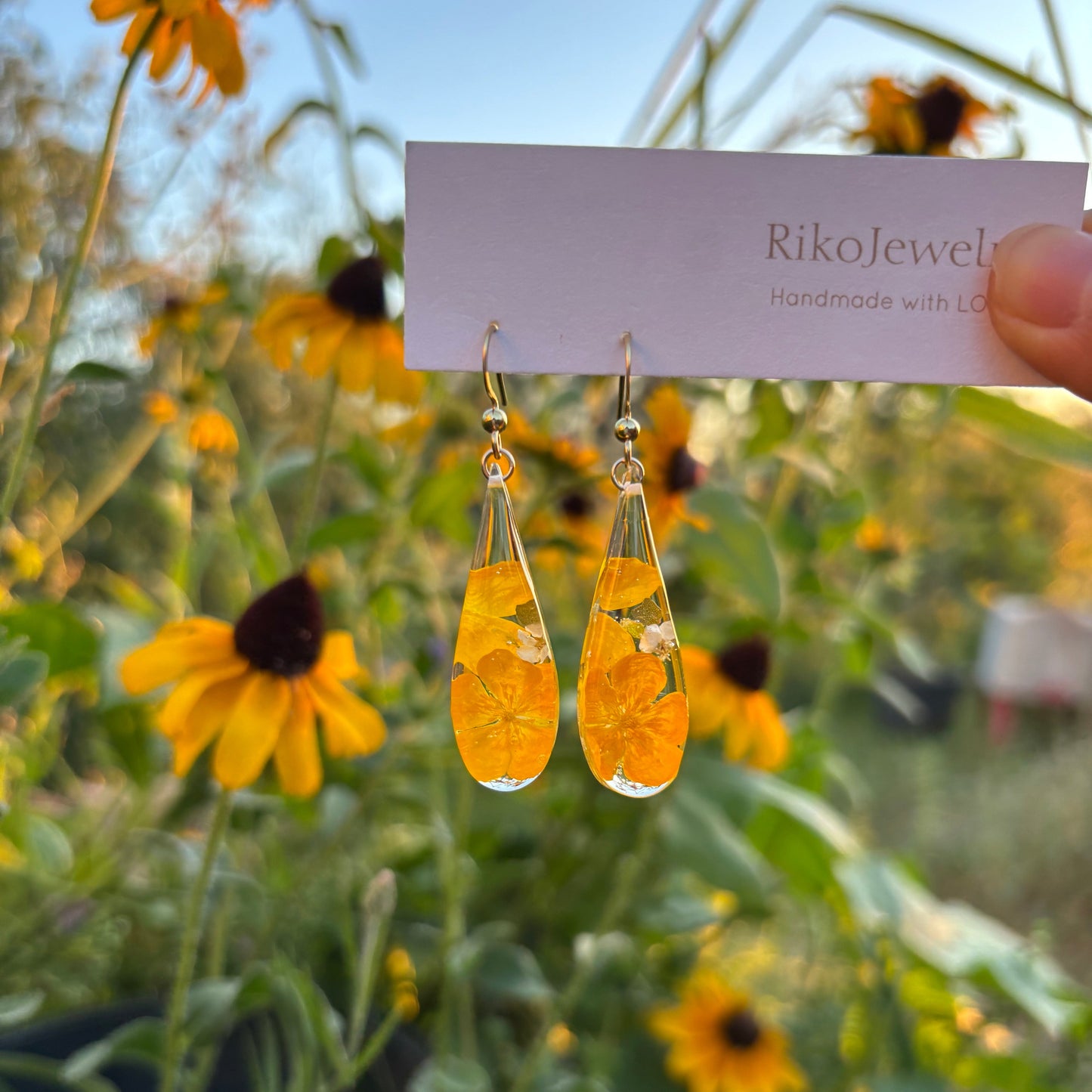 Bulbous buttercup flower and white alyssum flowers earrings