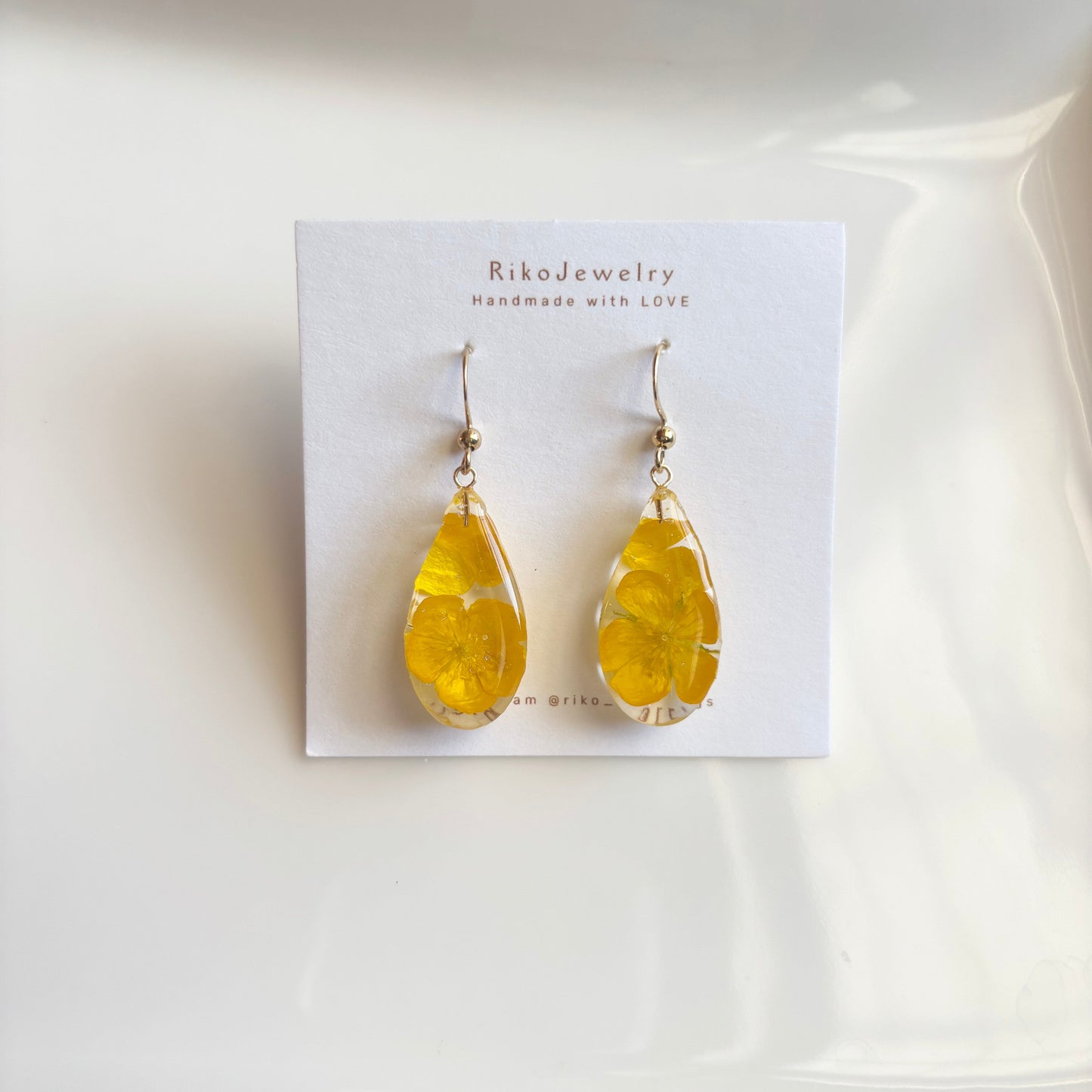 Bulbous buttercup flowers teardrop shaped earrings
