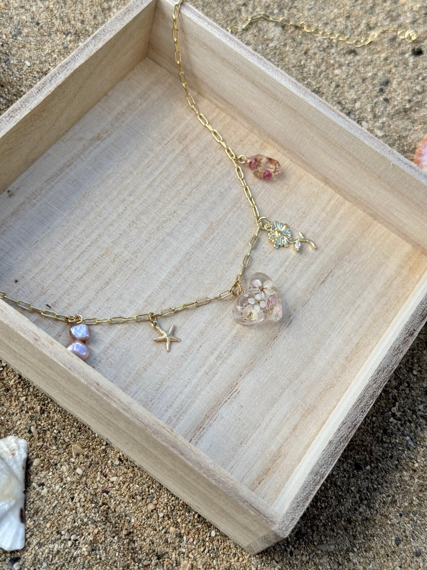 Pink alyssum heart and gold charms necklace