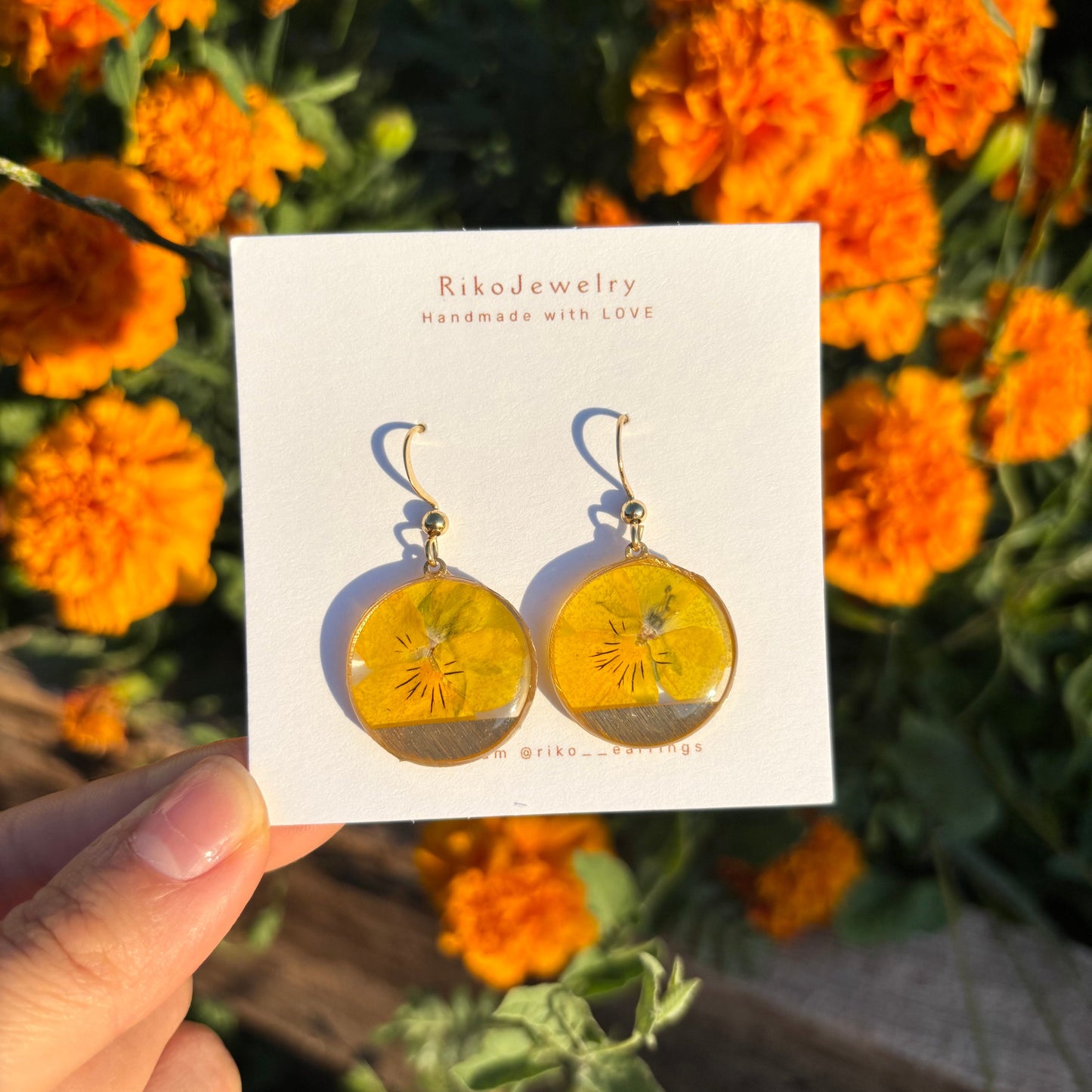 Yellow pansy round shaped earrings