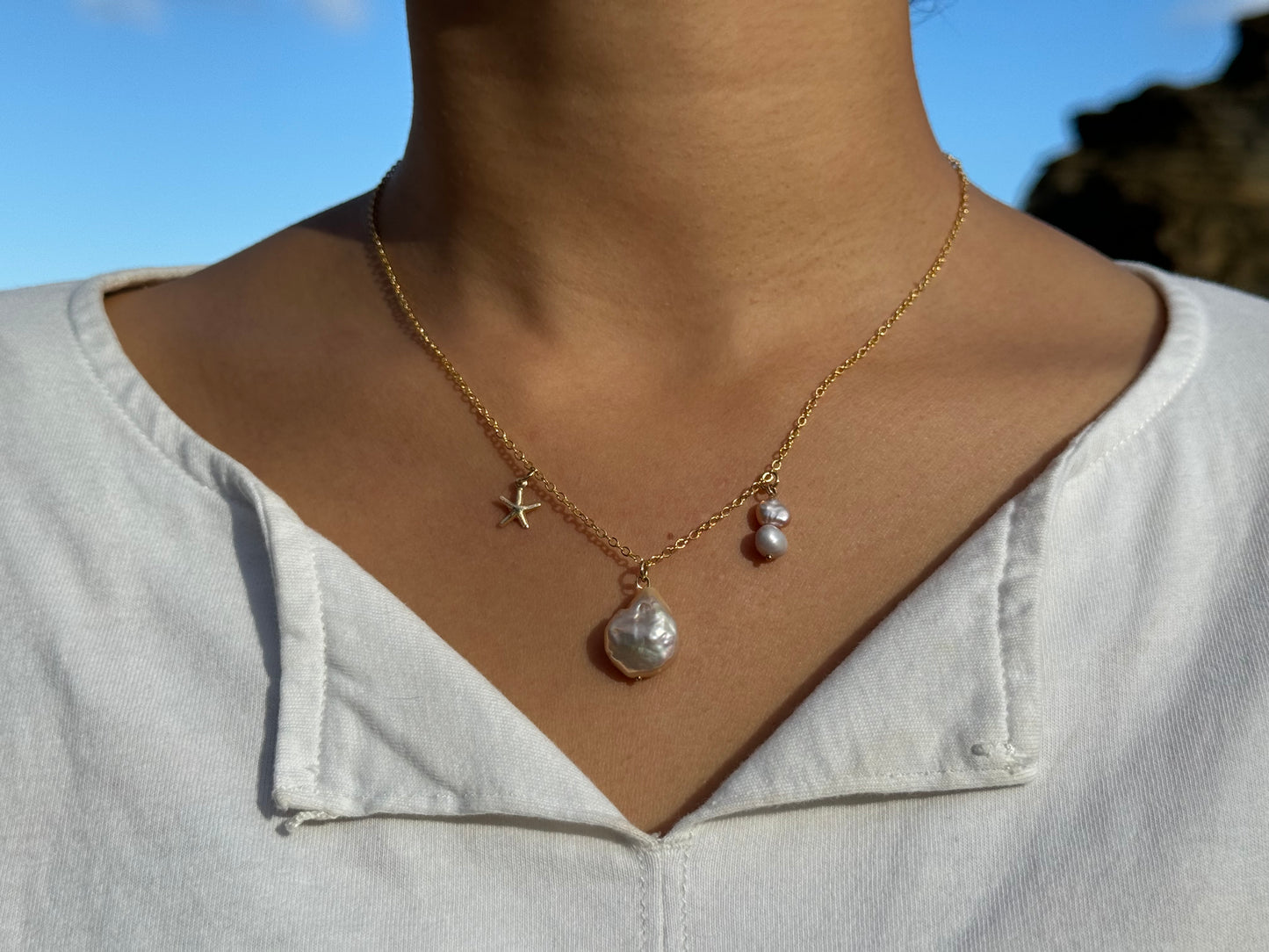 Beach themed pearl and gold charms necklace