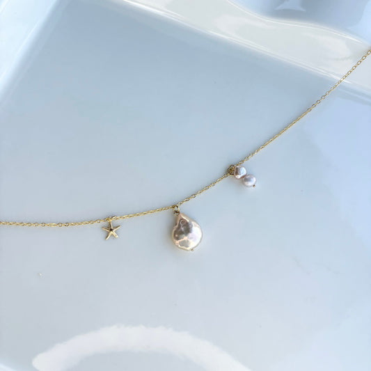 Beach themed pearl and gold charms necklace